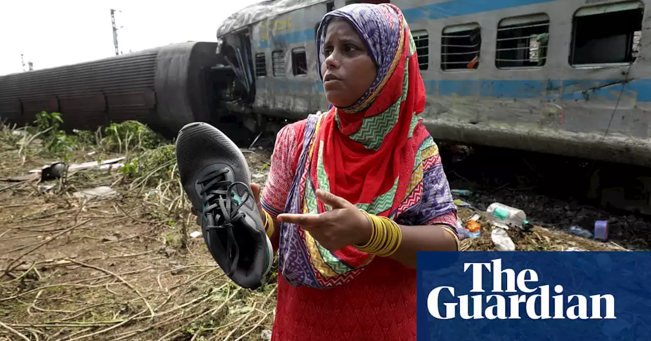 ‘I feel so helpless’: Indians search for missing family at train crash site