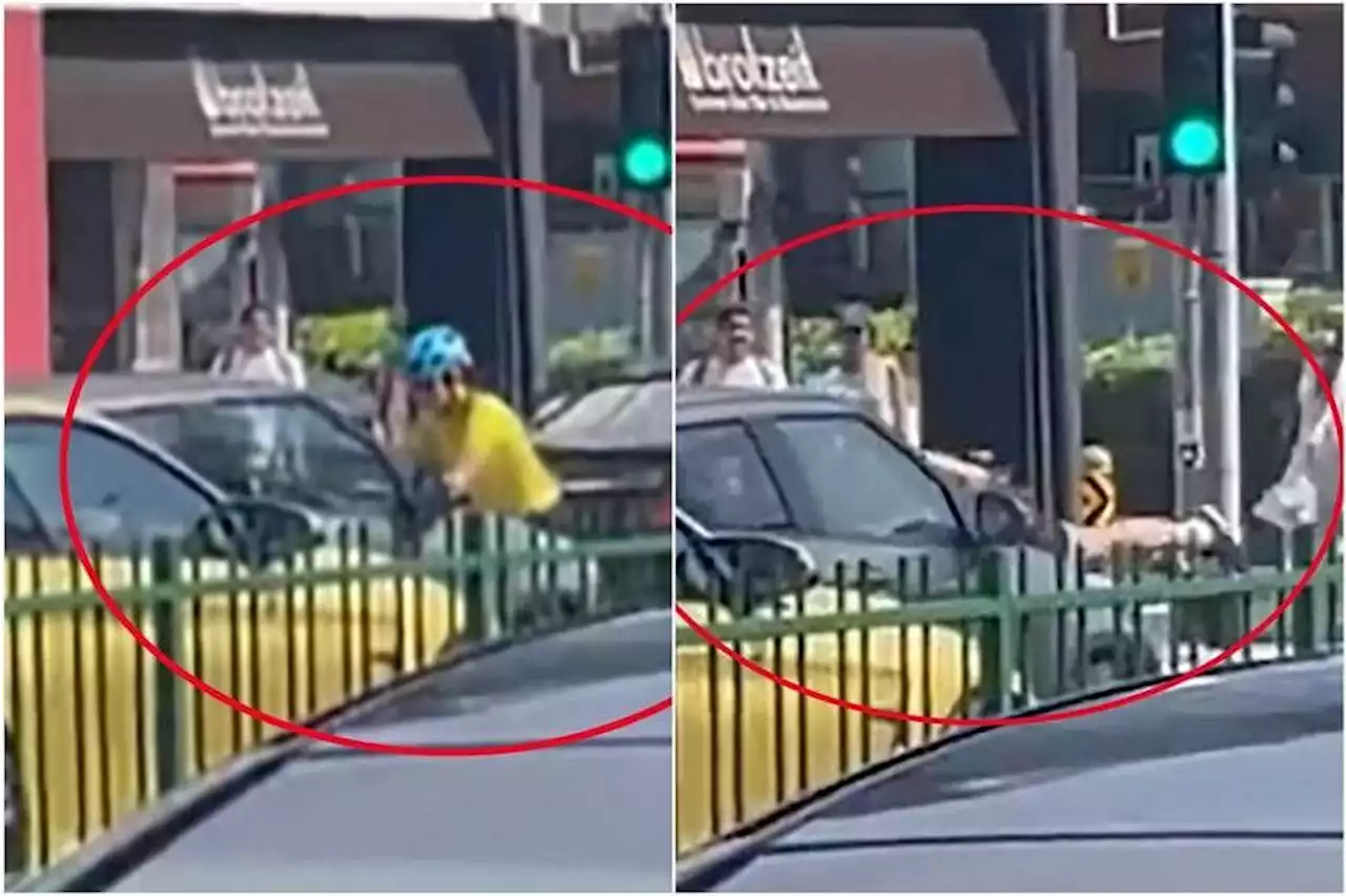 Two women arrested after cyclist jumps onto moving car’s bonnet in Katong