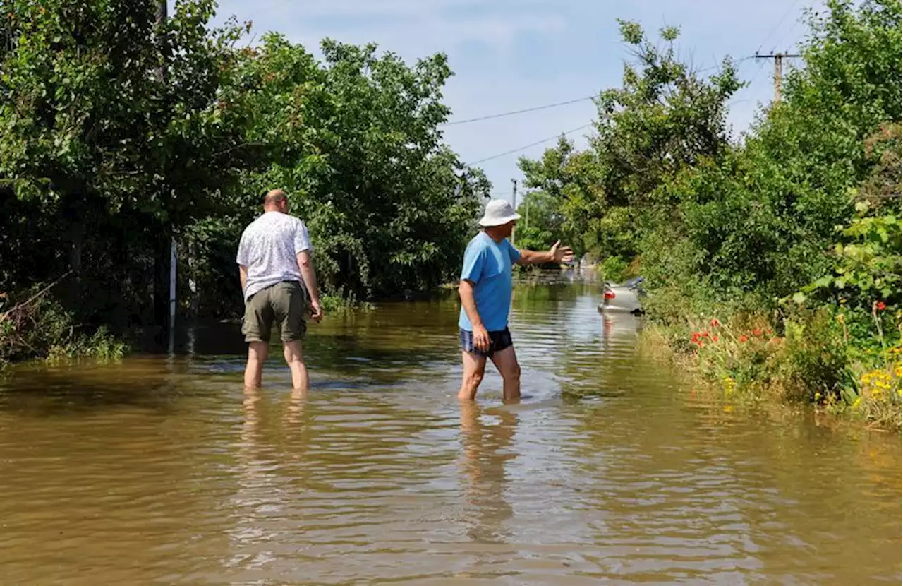 Villagers survey flooded homes and wait for help after Ukraine dam breach