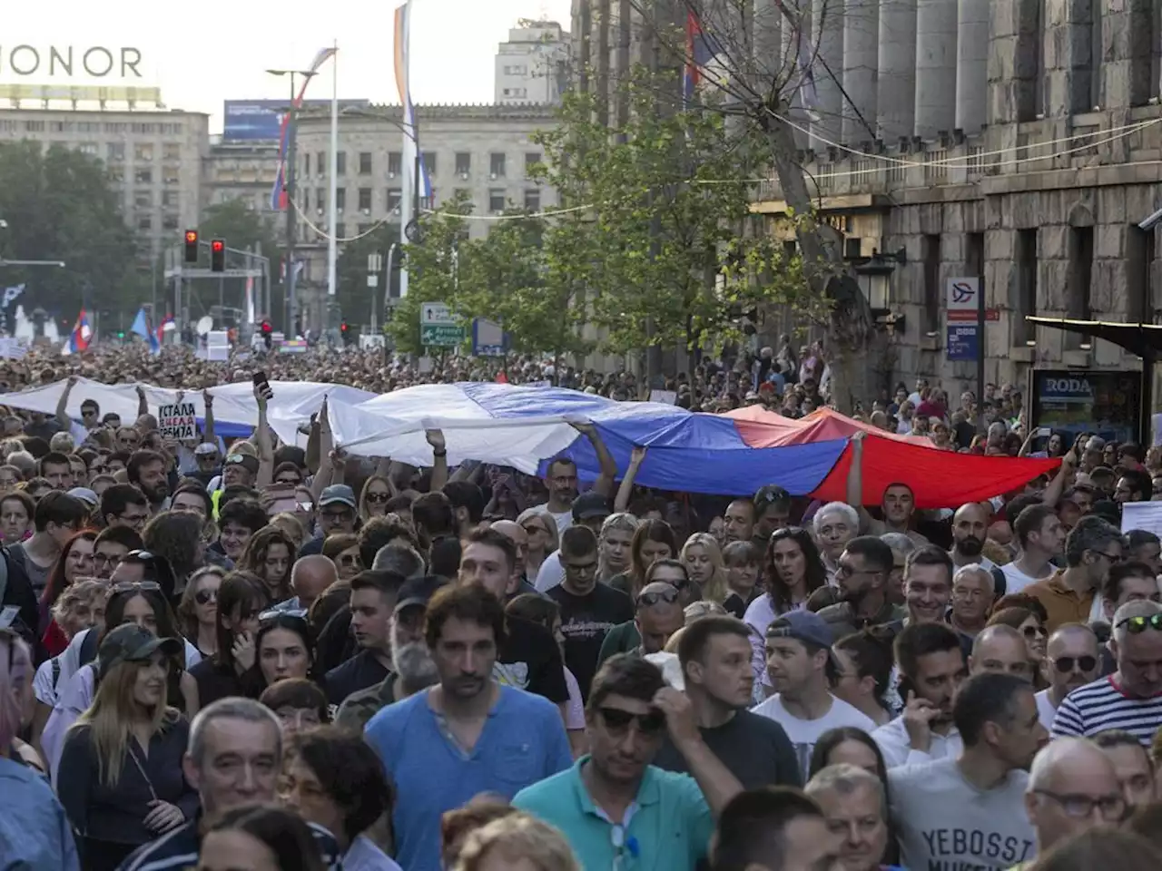 Serbia's president promises early election amid large protests against his populist rule