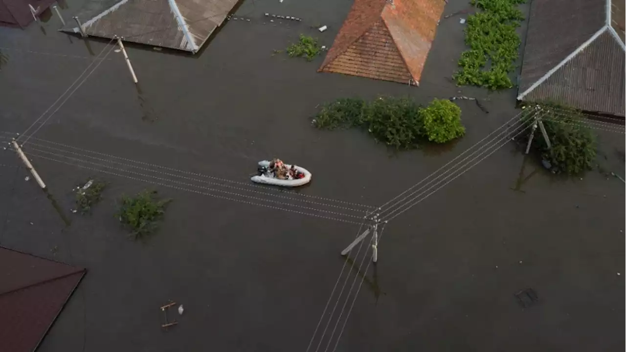 Zelenskyy visits area flooded by destroyed dam as five reported dead in Russian-occupied city