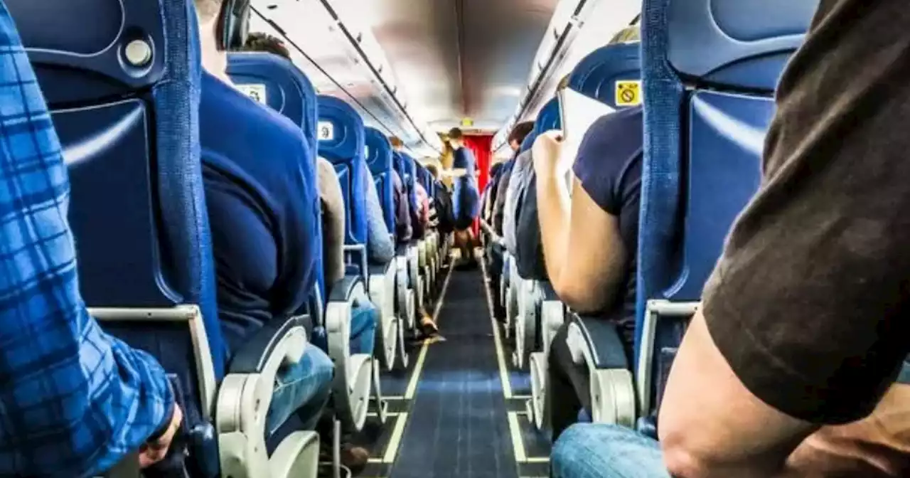 Woman says 'rights were violated' after '35st plane passenger sat on top of her'