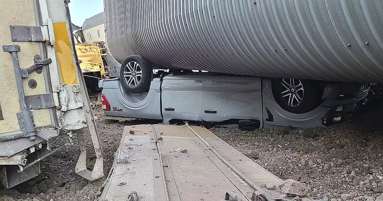 23 freight cars, new vehicles heavily damaged in train derailment in northern Arizona