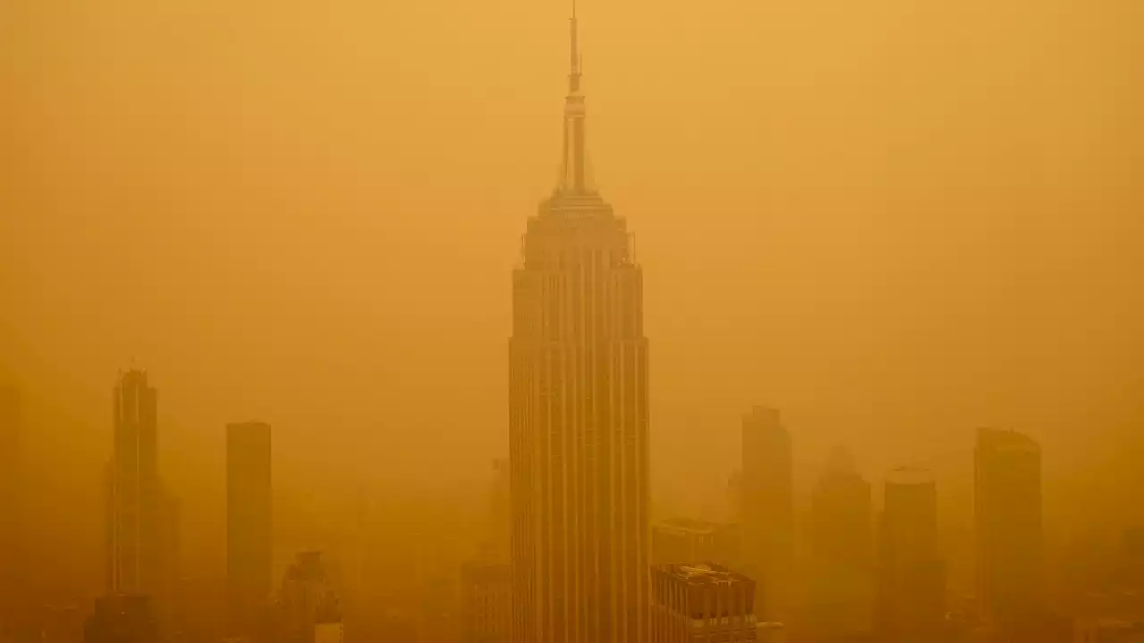 Incredible images show NYC engulfed in a thick haze as wildfires rage