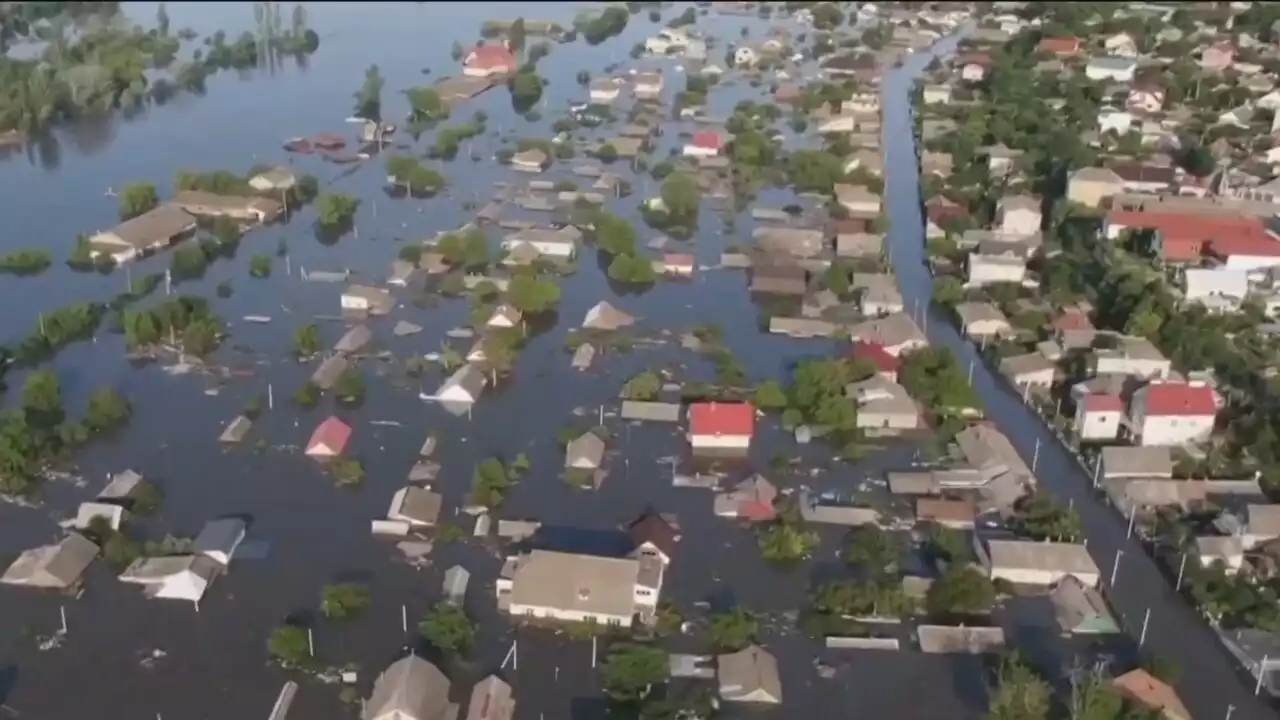 Ukraine residents sleep on rooftops amid extreme flooding