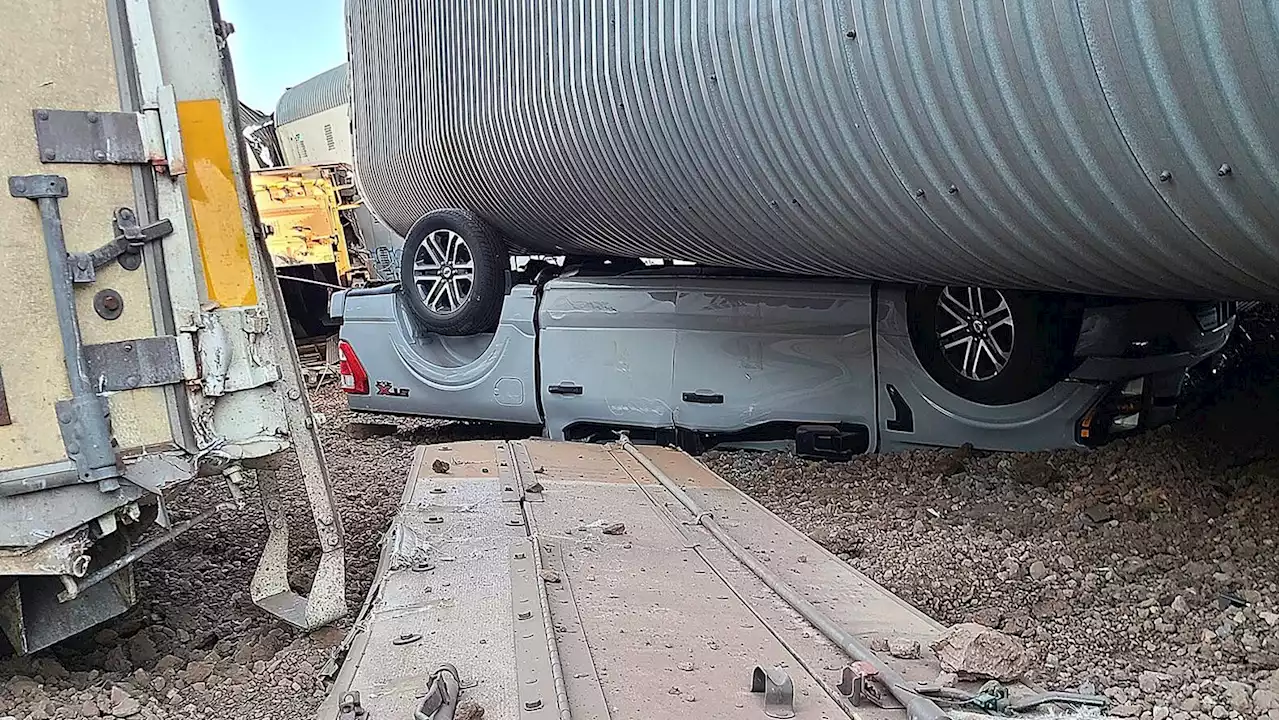 New vehicles, freight cars damaged in Arizona train derailment