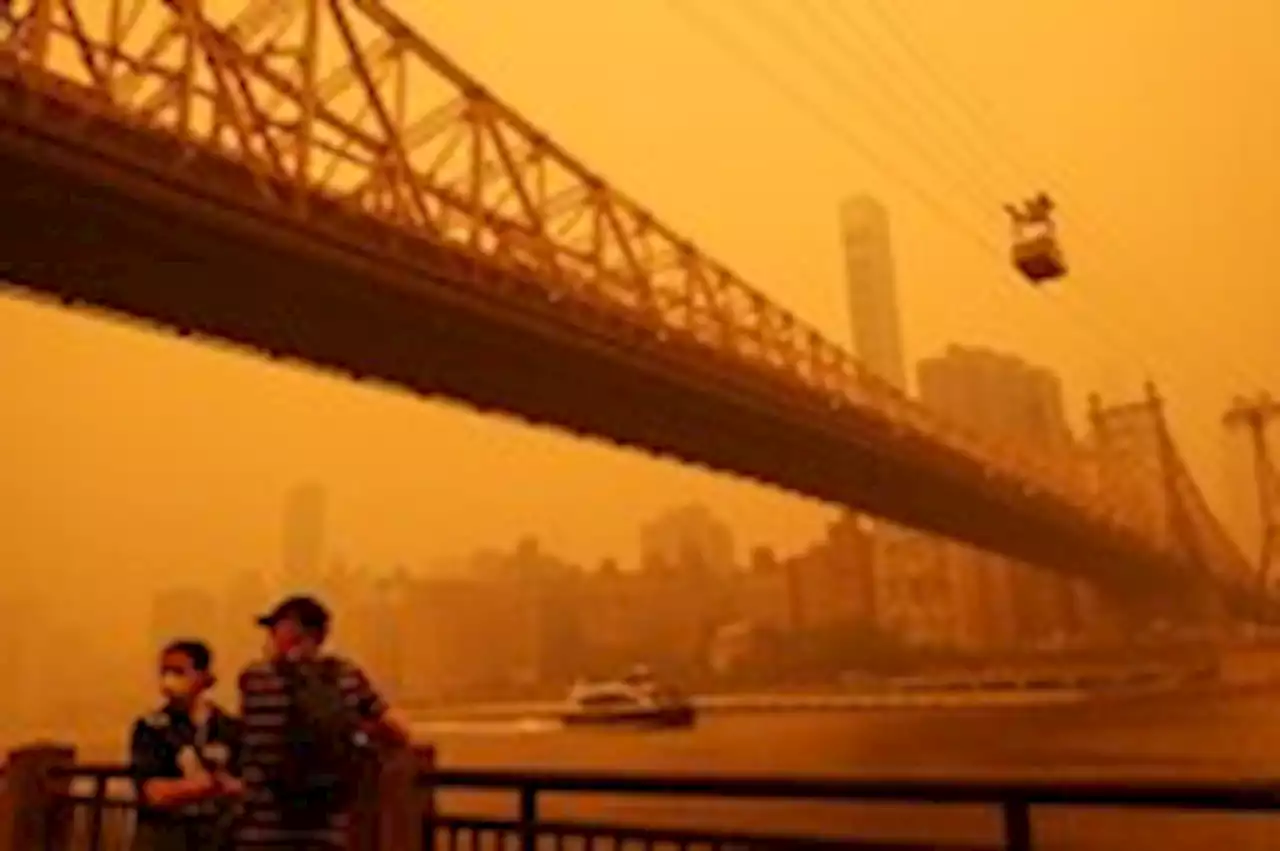 Smoke from Canadian wildfires engulfs East Coast, upending daily life