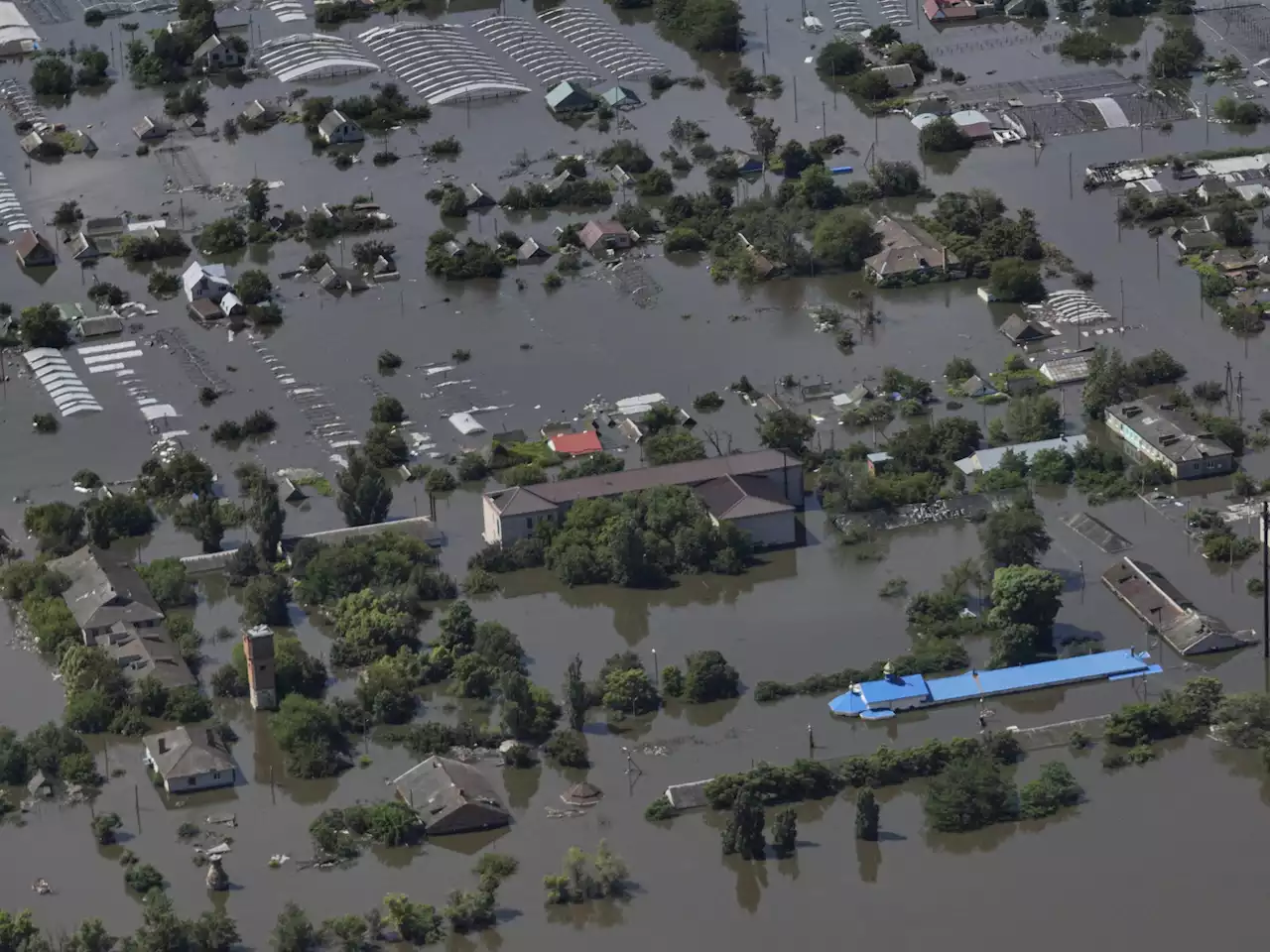 A dam collapses and thousands face the deluge — often with no help — in Russian-occupied Ukraine