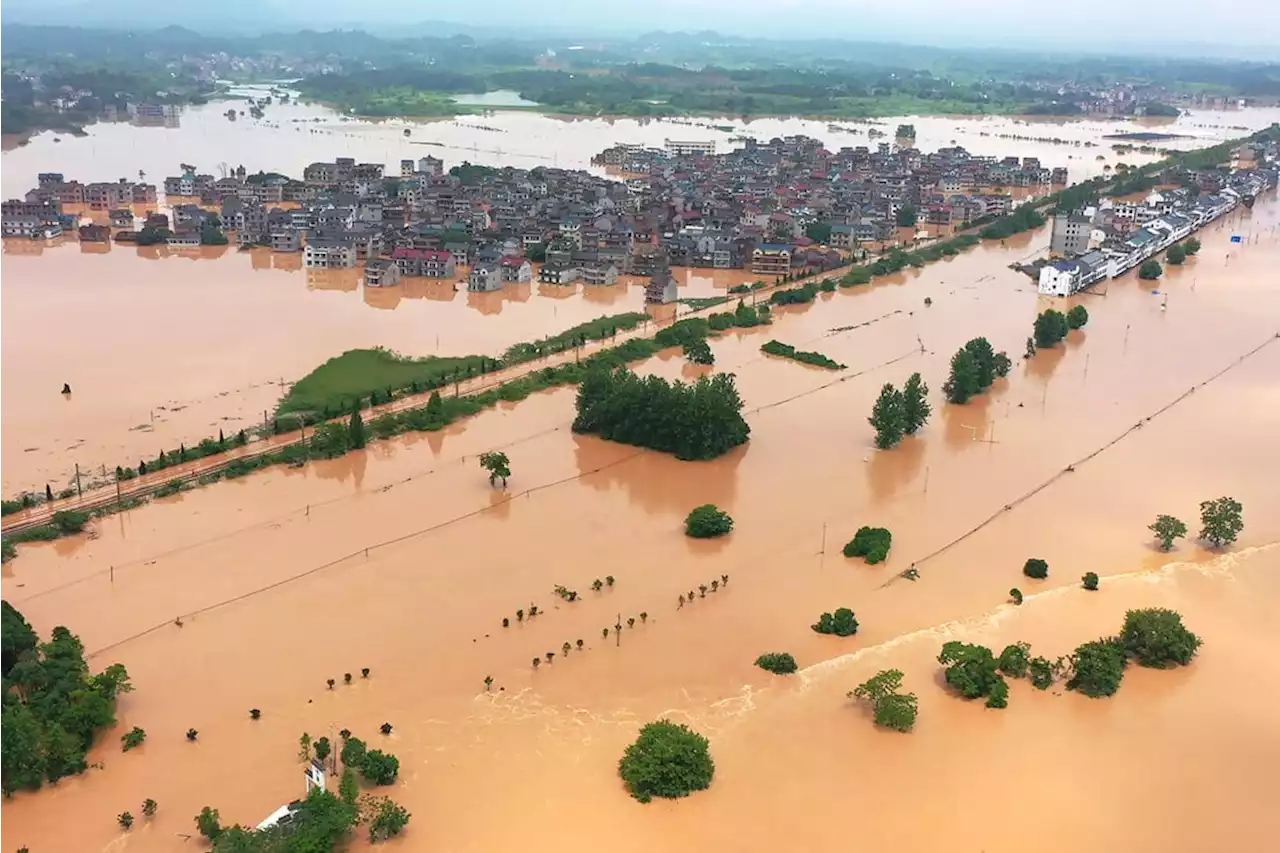 Cities flooded after ‘dragon boat water’ rains lash China