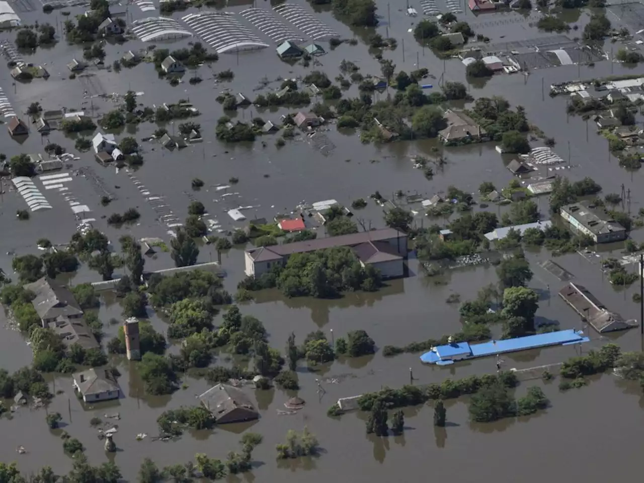 A dam collapses and thousands face the deluge - often with no help - in Russian-occupied Ukraine