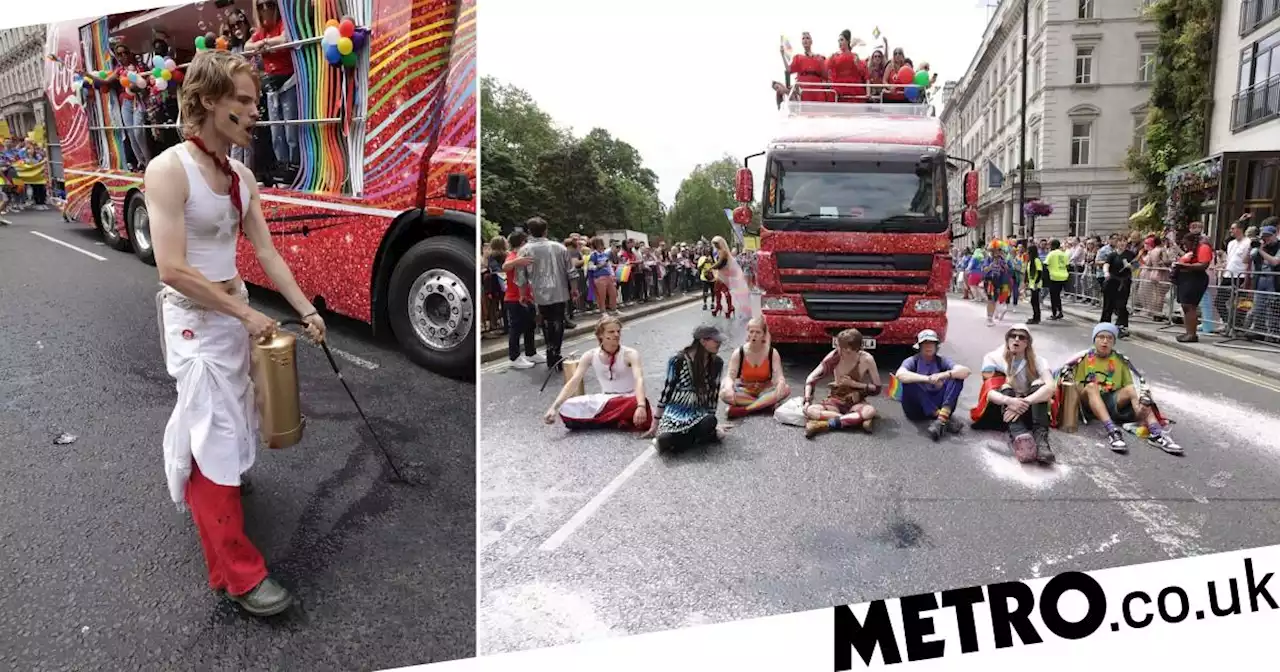 Just Stop Oil block Pride in London parade and spray paint over road