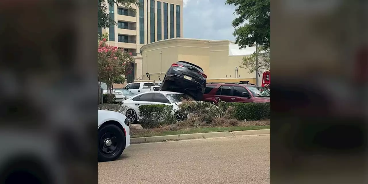 Man’s car ends up on top of another car at Mississippi mall