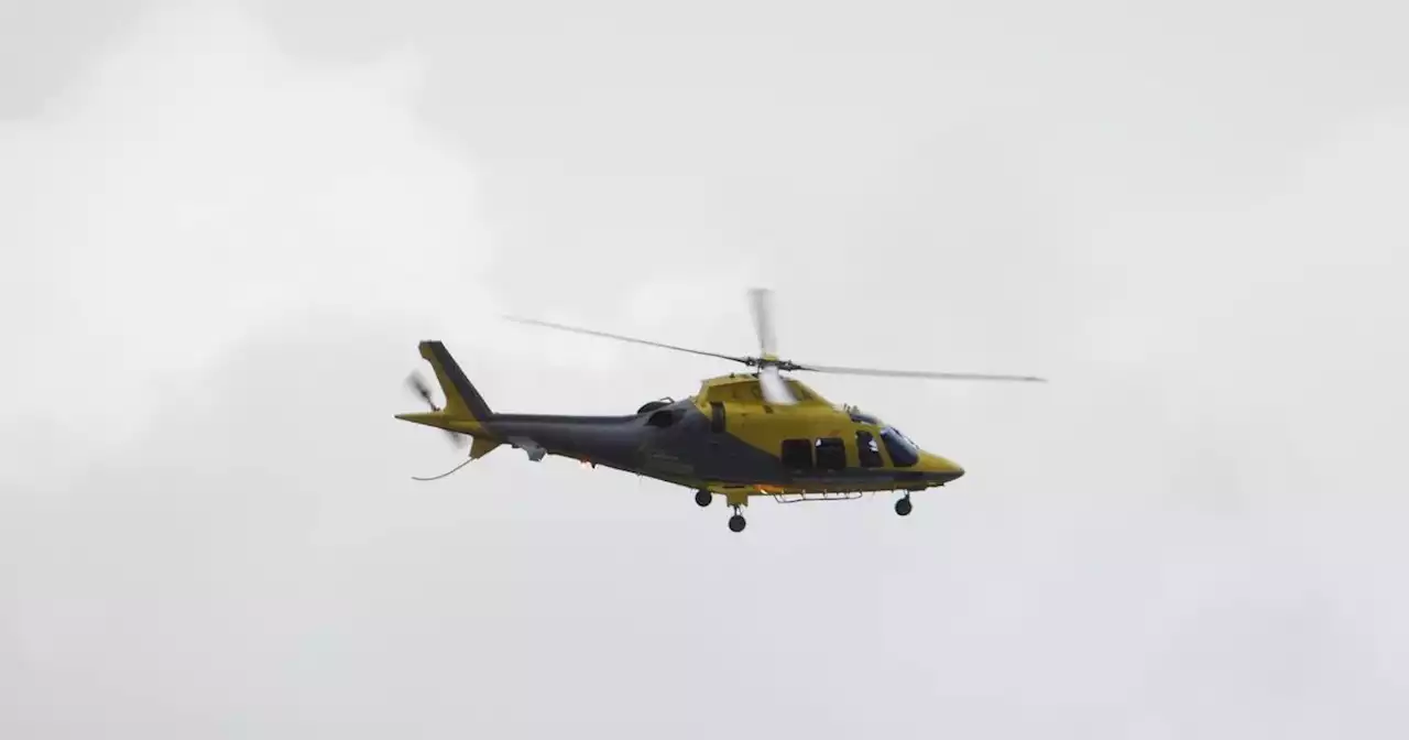 Air ambulance seen flying above area before landing on school field