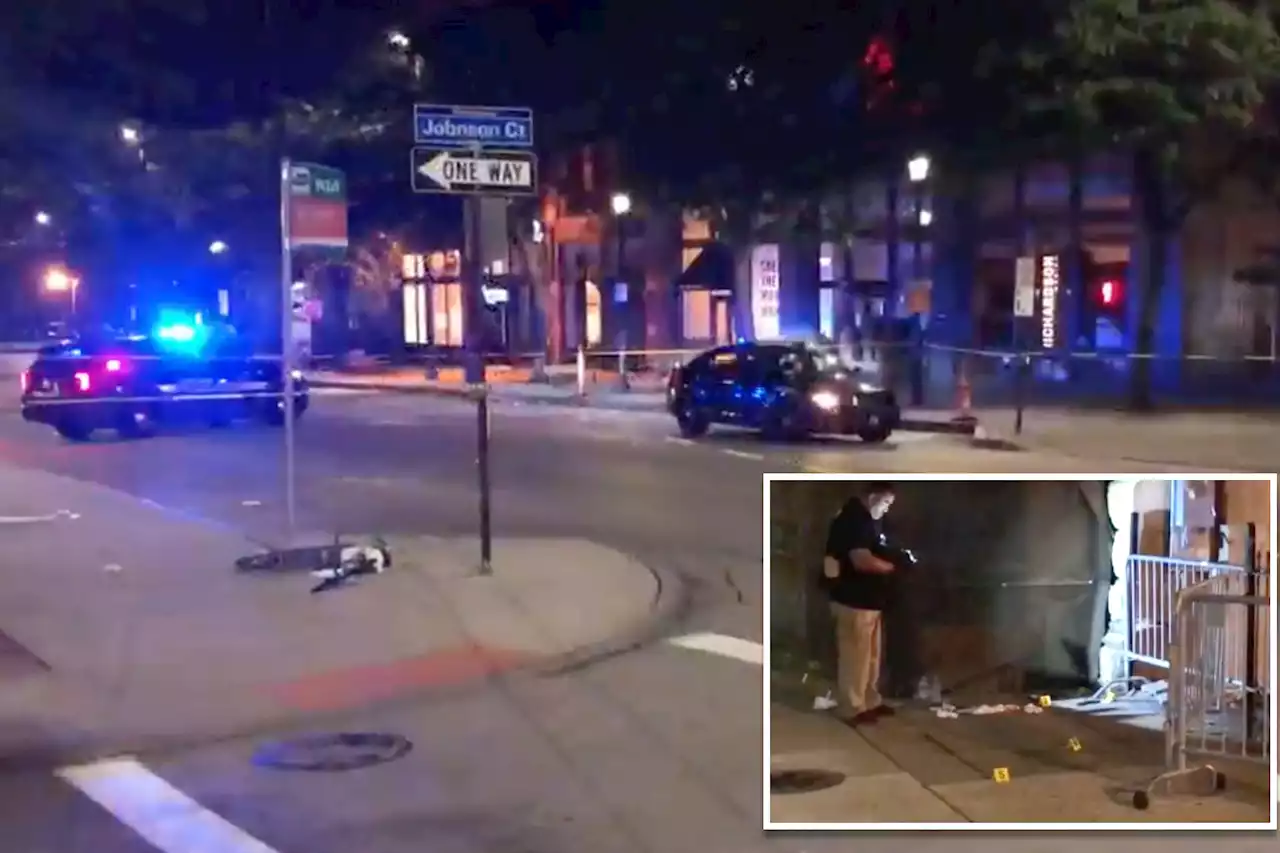 Cops search for gunman who injured nine after firing into a crowded street corner in Cleveland