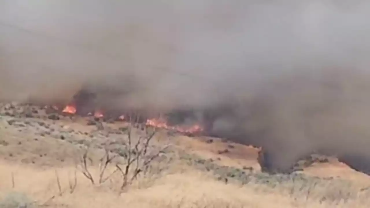 Growing wildfire in central Washington prompts evacuations, threatens homes and farms