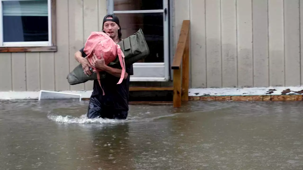 A surging river threatens Vermont's capital as crews rescue more than 100 from swift water