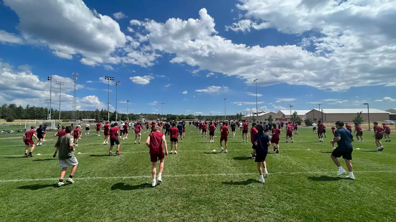 'Building trust': Arizona high school football teams escape heat at camps