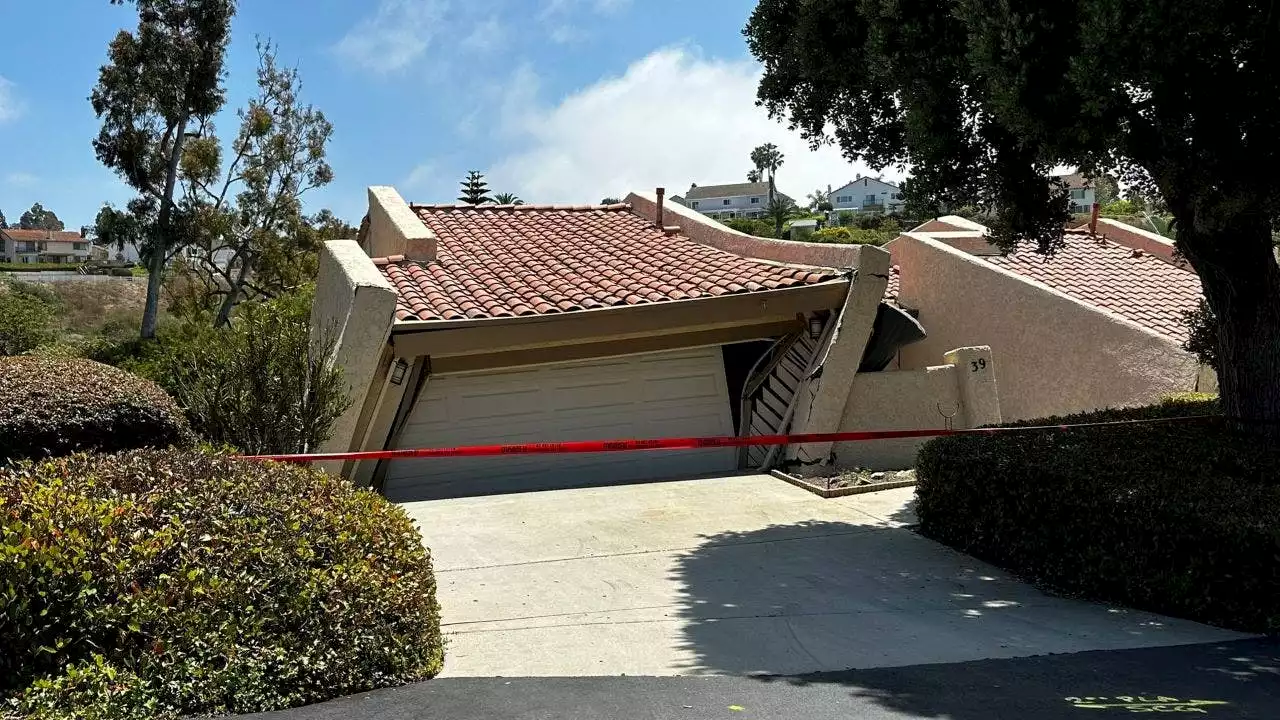 California officials waiting for 12 homes to fall into canyon after massive landslide