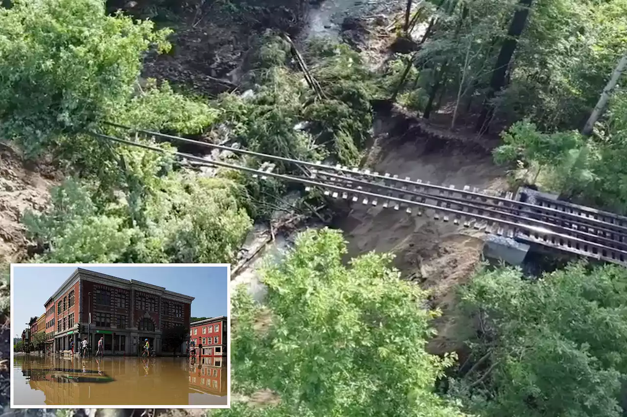 Aerial footage shows railroad tracks suspended in air after Vermont flooding wipes out trestle