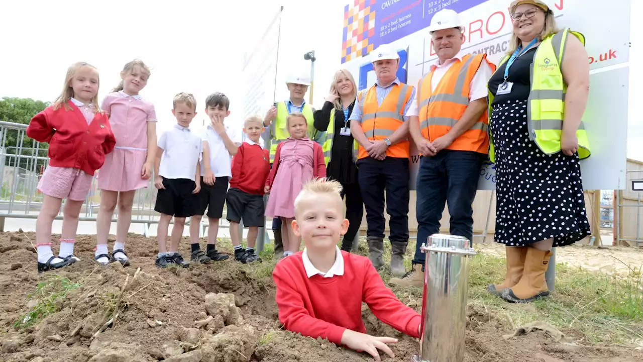 Reception pupils bury time capsule at Boston housing development