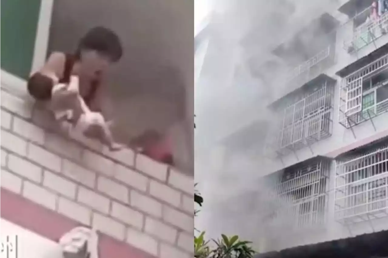 'Please save my baby!': Woman in China throws baby out of burning flat