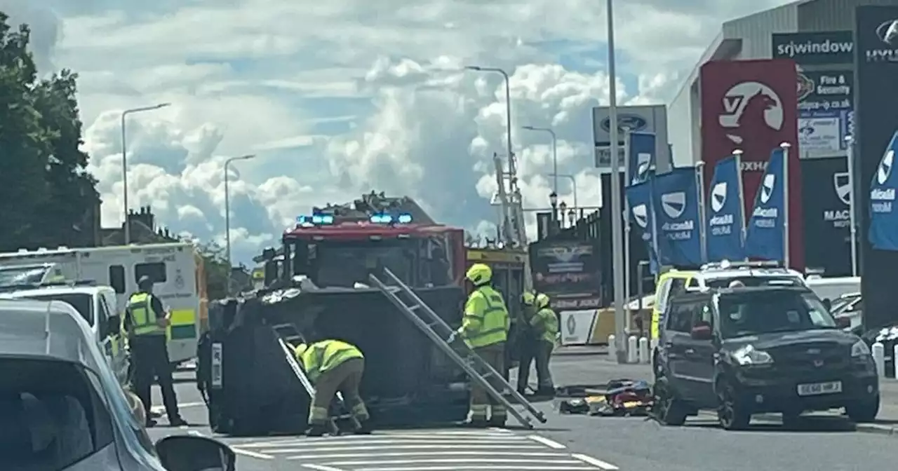 Car flips on side after two-vehicle smash on Scots road as cops lock down scene