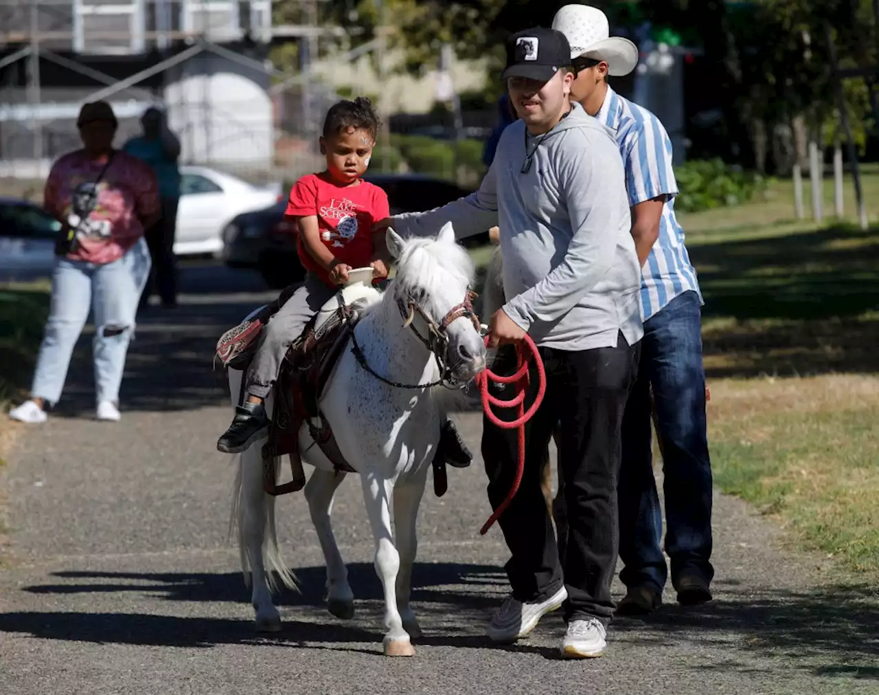 Photos: Oakland police host CommUNITY Tour at DeFremery Park