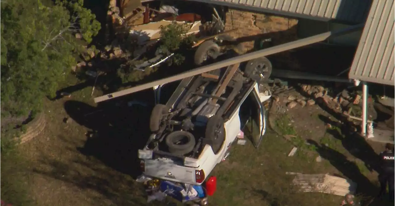 Ute flips on its roof after smashing into home in Brisbane