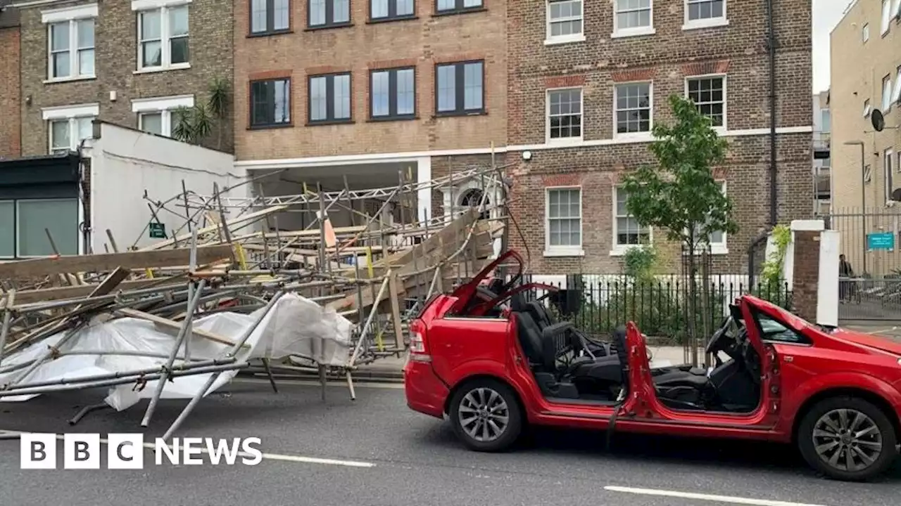 Woman hurt in Hackney as wind blows scaffolding on car