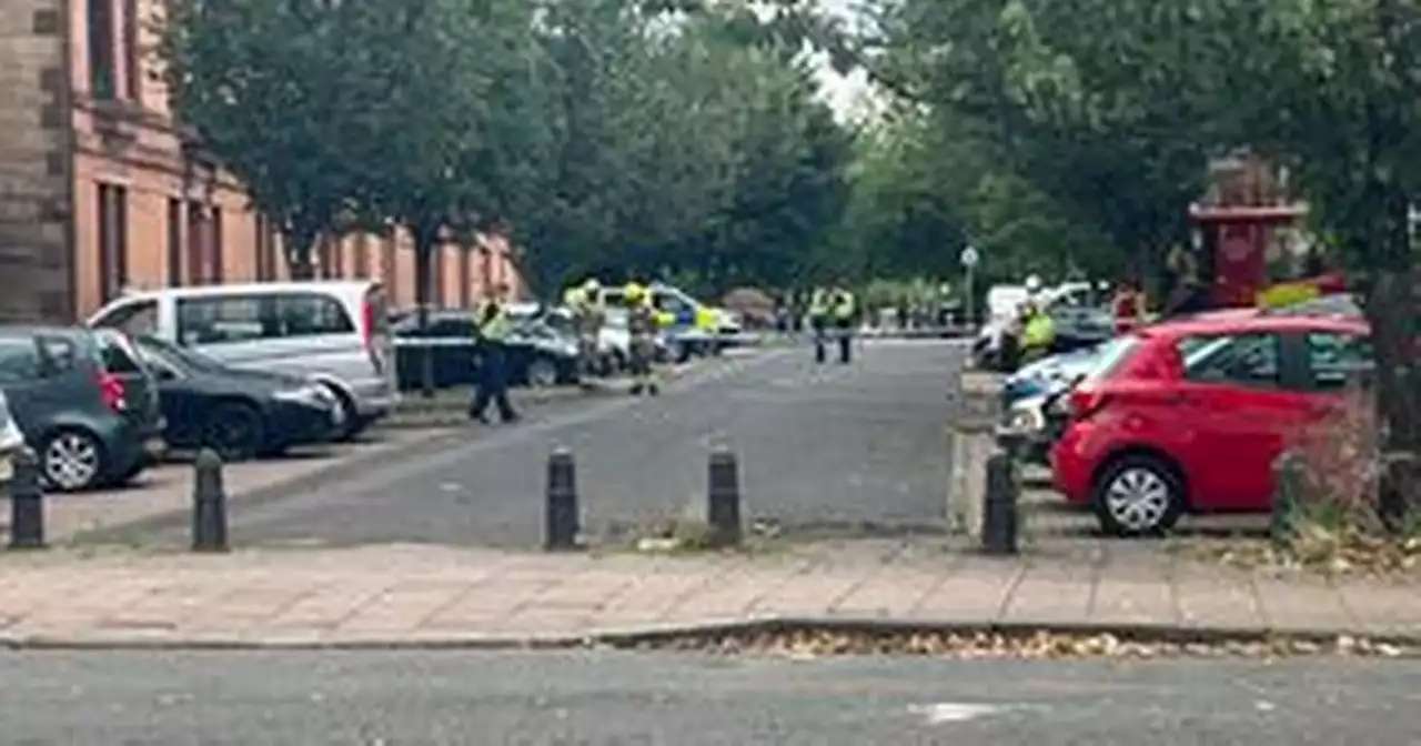 Glasgow street partially cordoned off as emergency services 'smash' flat window