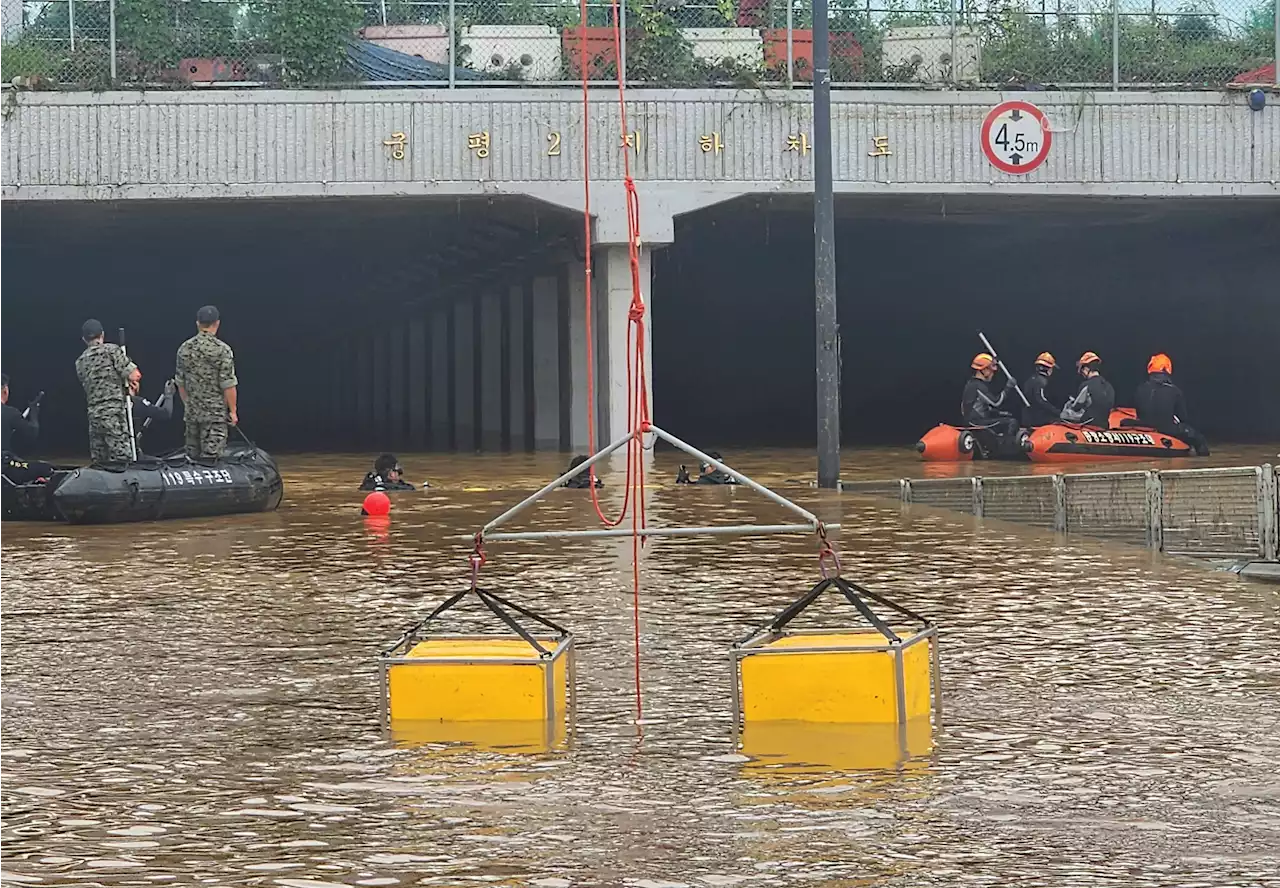 9 bodies pulled from a flooded road tunnel in South Korea as rains cause flash floods and landslides