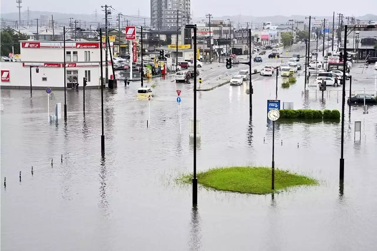 Man dies after being trapped in flooded car as torrential rain hits Japan