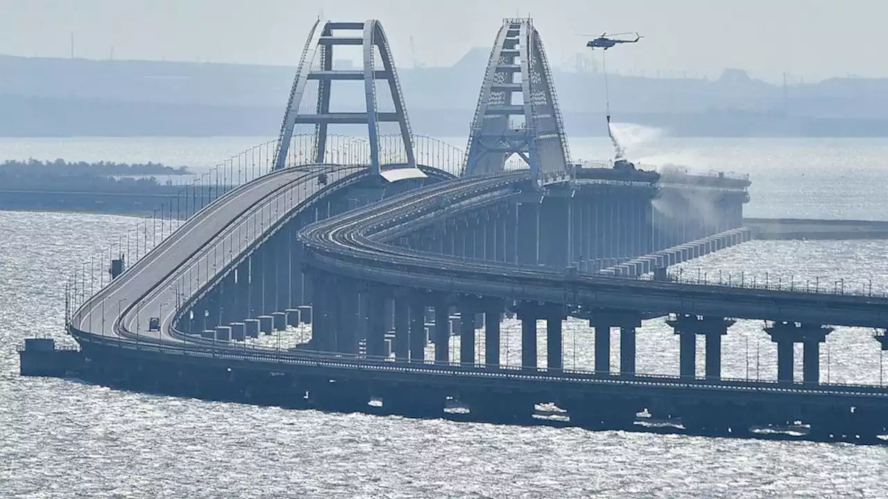 Traffic on key bridge connecting Crimea to Russia's mainland halted amid reports of explosions