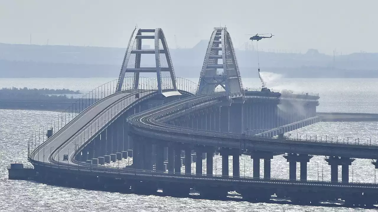 Traffic on key bridge from Crimea to Russia's mainland halted amid reports of explosions and deaths