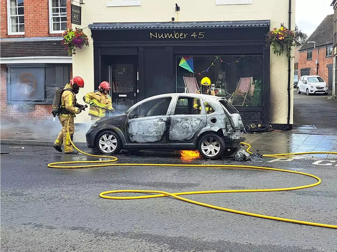 Car destroyed by fire in town high street incident