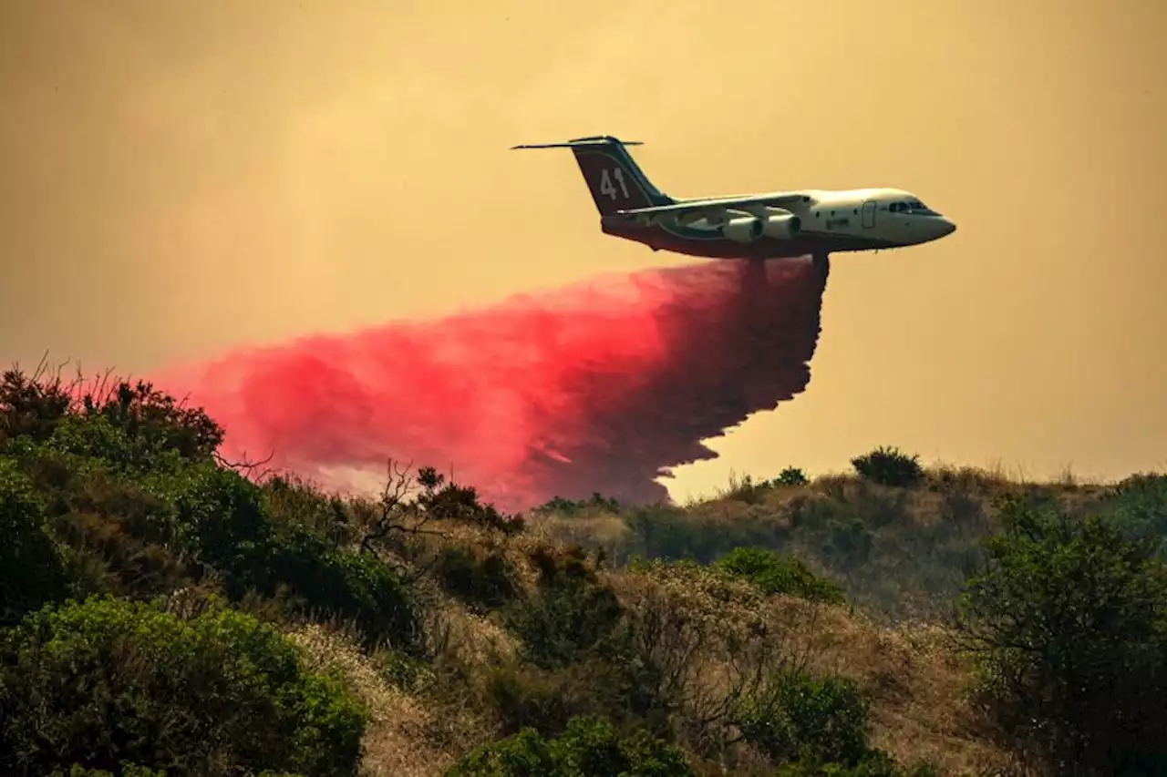 Photos: Fast-moving fires force evacuations, char thousands of acres in Riverside County