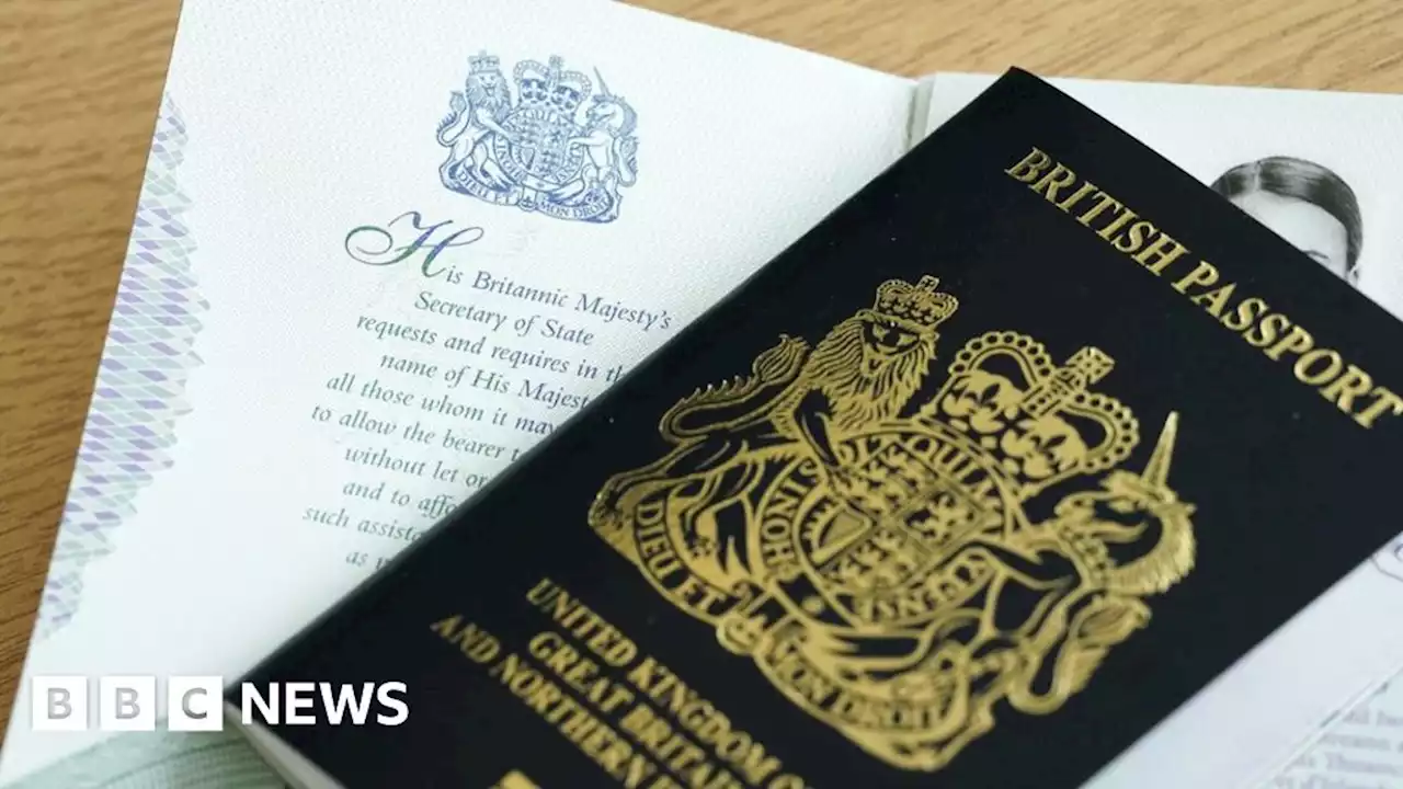 First British passports issued with King's name