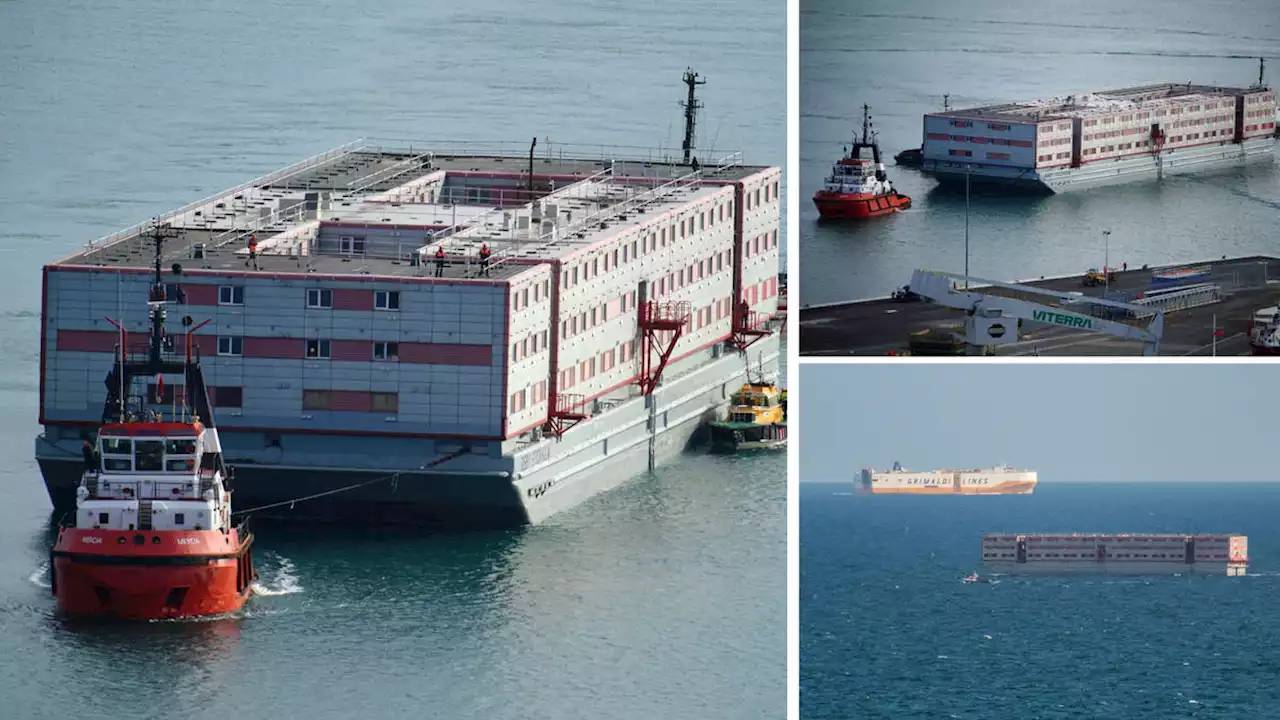 Barge to house asylum seekers docks in Dorset as protesters gather on the quayside