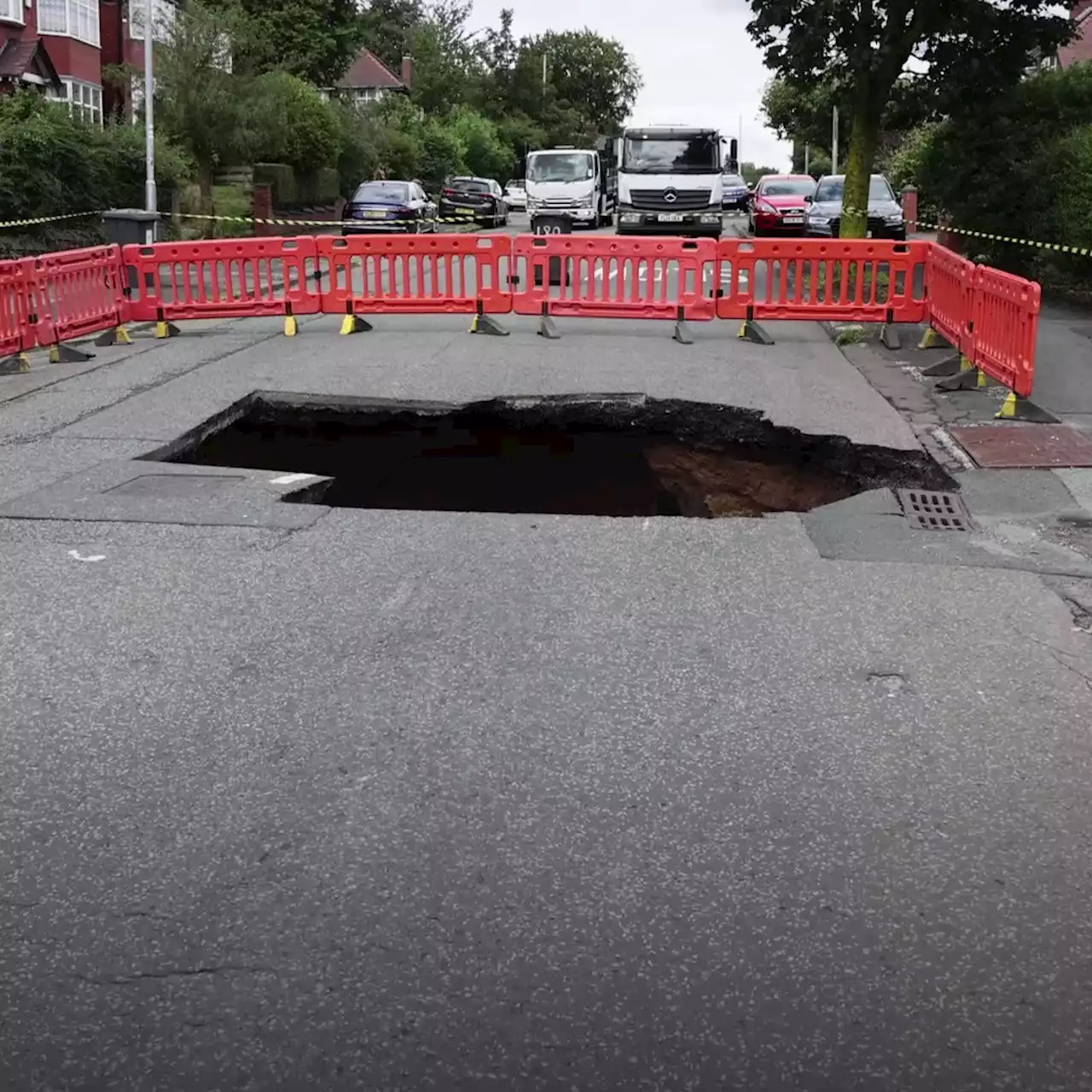 Lightning, flooding, a SINKHOLE... storms hit Greater Manchester again