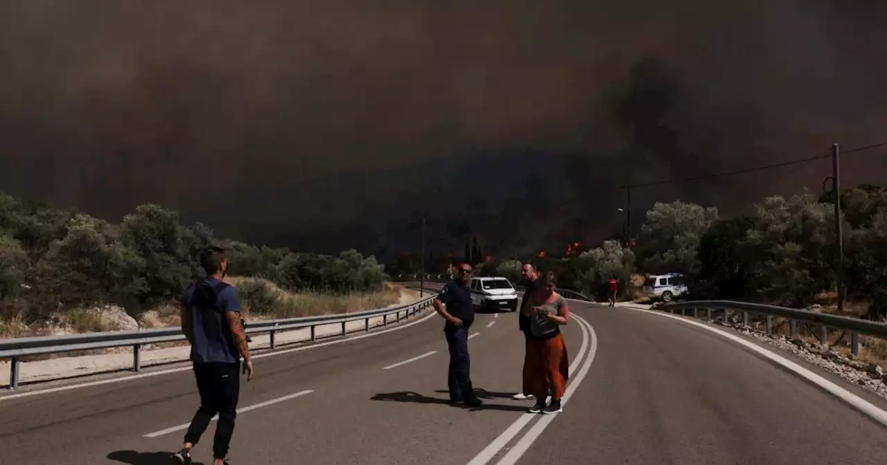 Greece closes motorways to stop wildfires spreading to oil refinery