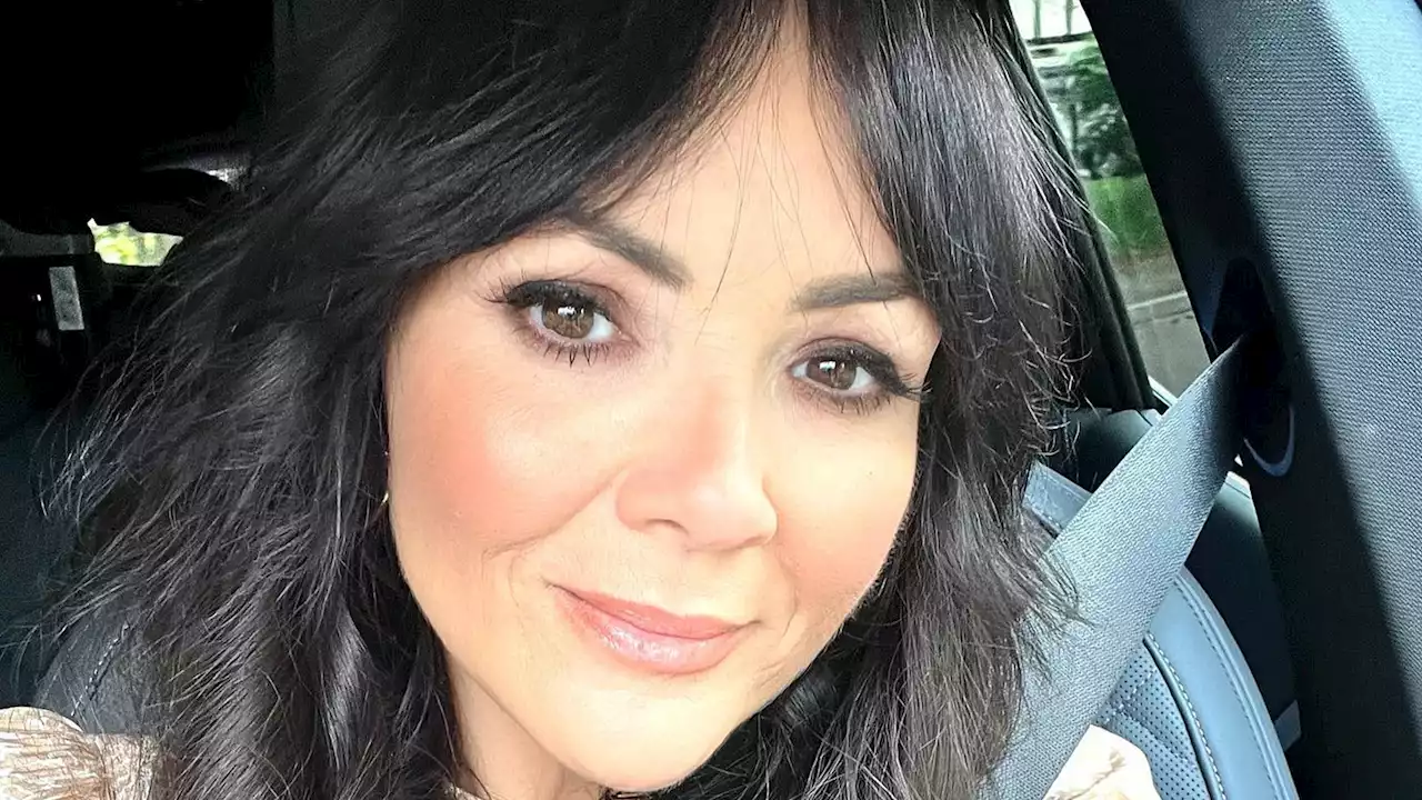 Martine McCutcheon looks slimmer than ever in white and blue summer dress