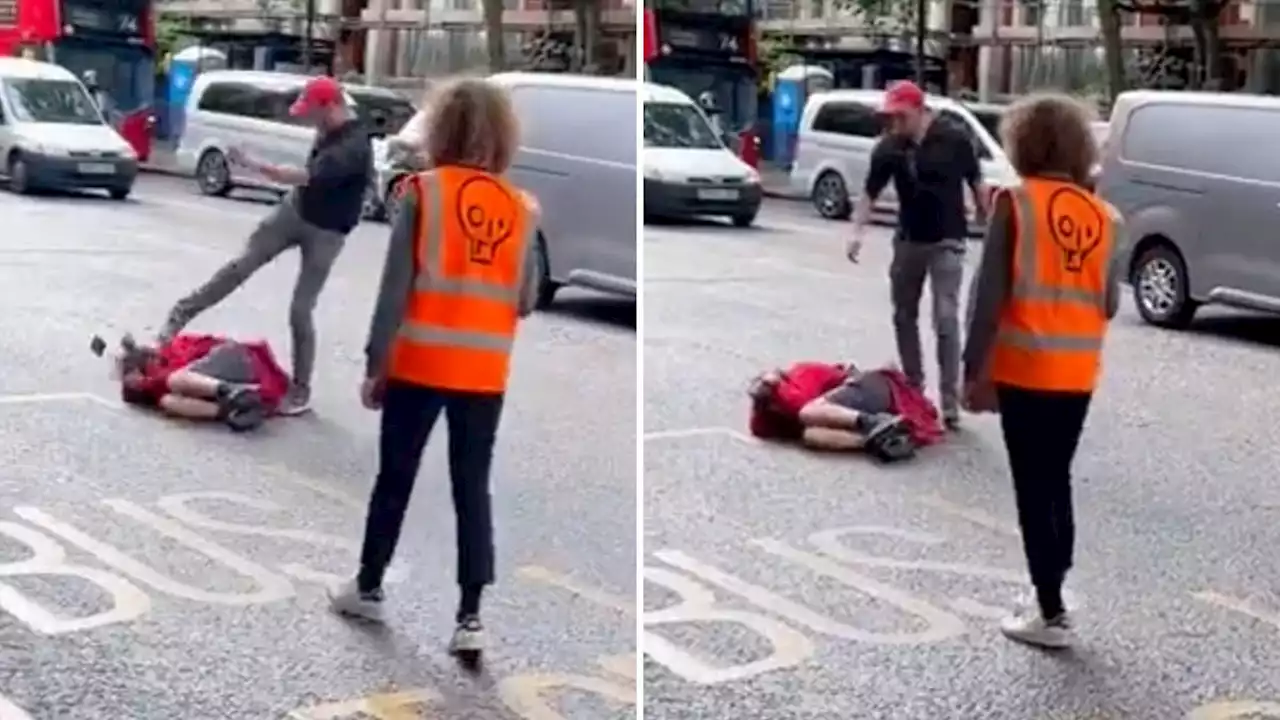 Moment furious motorist throws punch and kicks at Just Stop Oil protester in London street