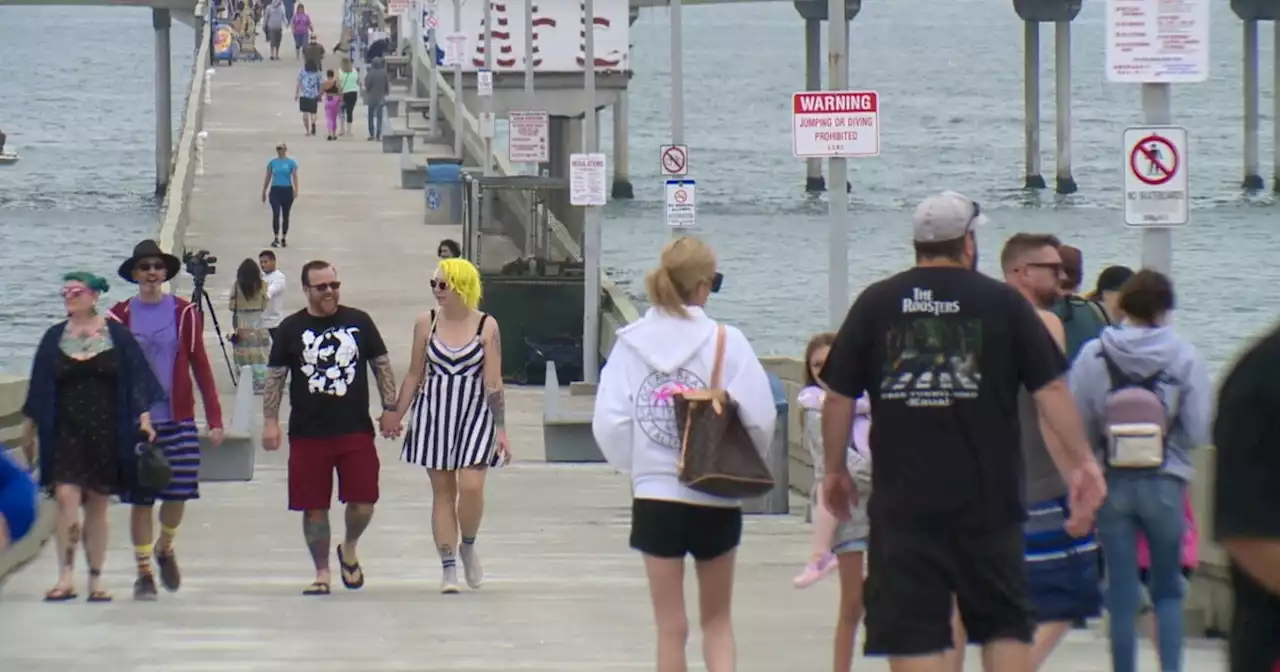 Eager crowds gather for reopening of Ocean Beach Pier after 6-month closure