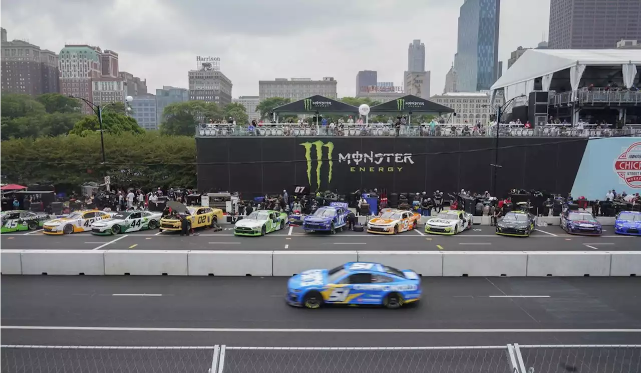 Heavy rains flood Chicago roads and force NASCAR to cut short a downtown street race