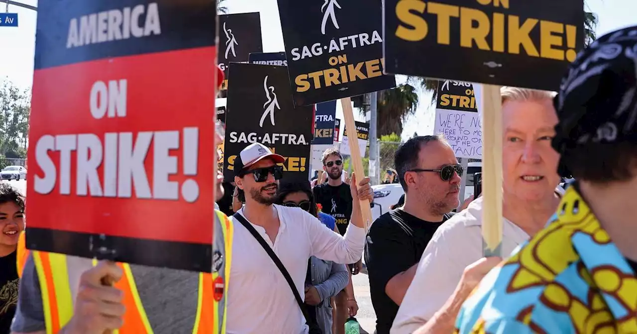 Chicago SAG-AFTRA members walking in solidarity with Hollywood Actors on strike