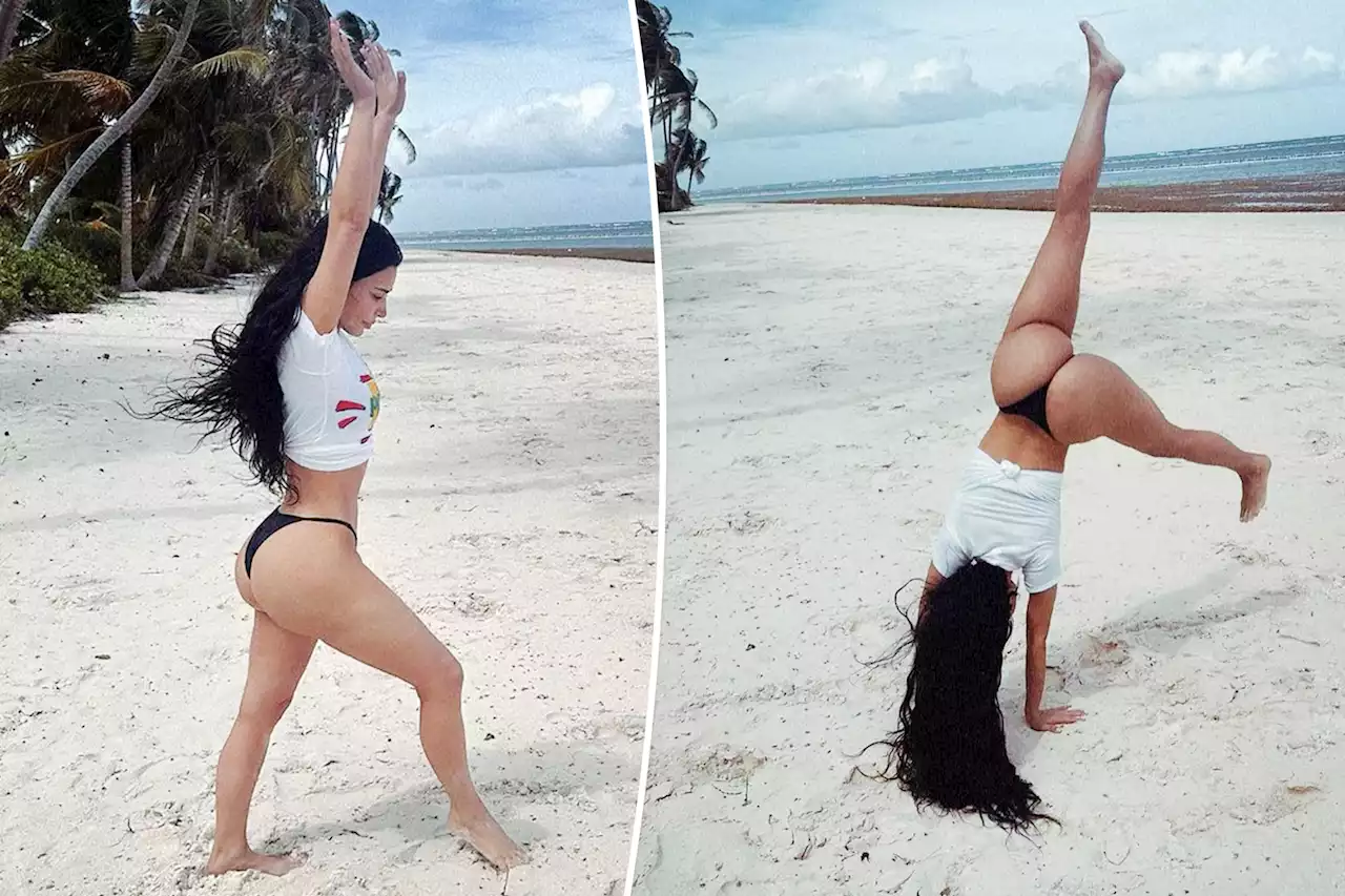 Kim Kardashian shows off cartwheeling ability in a thong