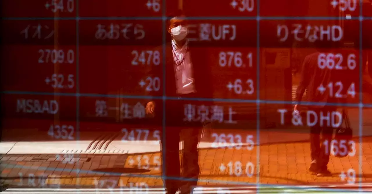 Asia stocks gain; US futures slip after Netflix, Tesla earnings