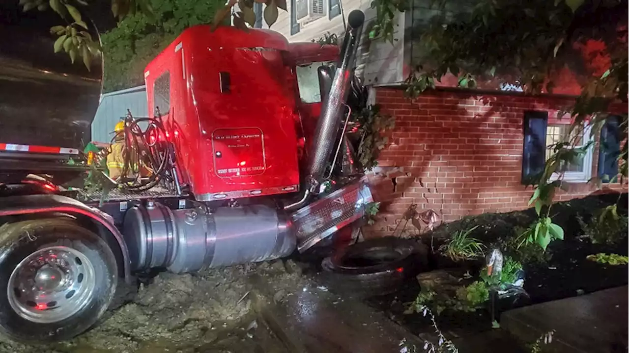 Driver hospitalized after tractor-trailer collides with home in Lancaster Co.