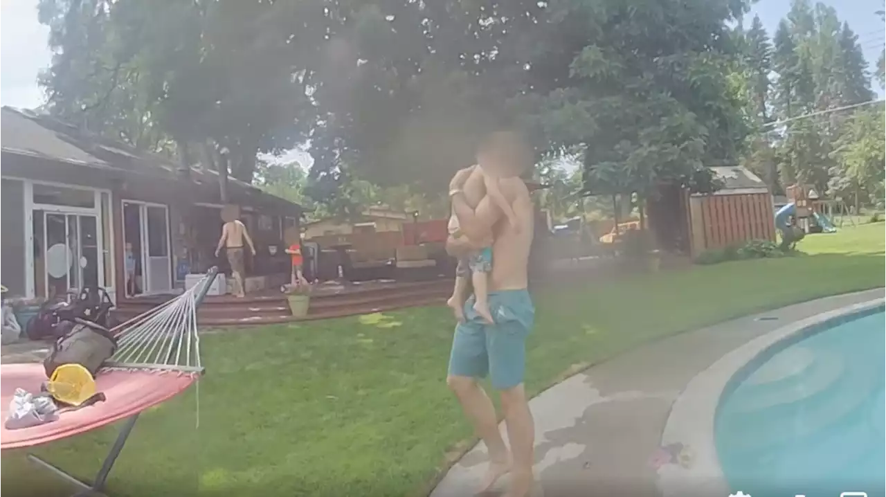 Dramatic video shows Michigan police officer helping save 2-year-old spotted 'lifeless' in pool