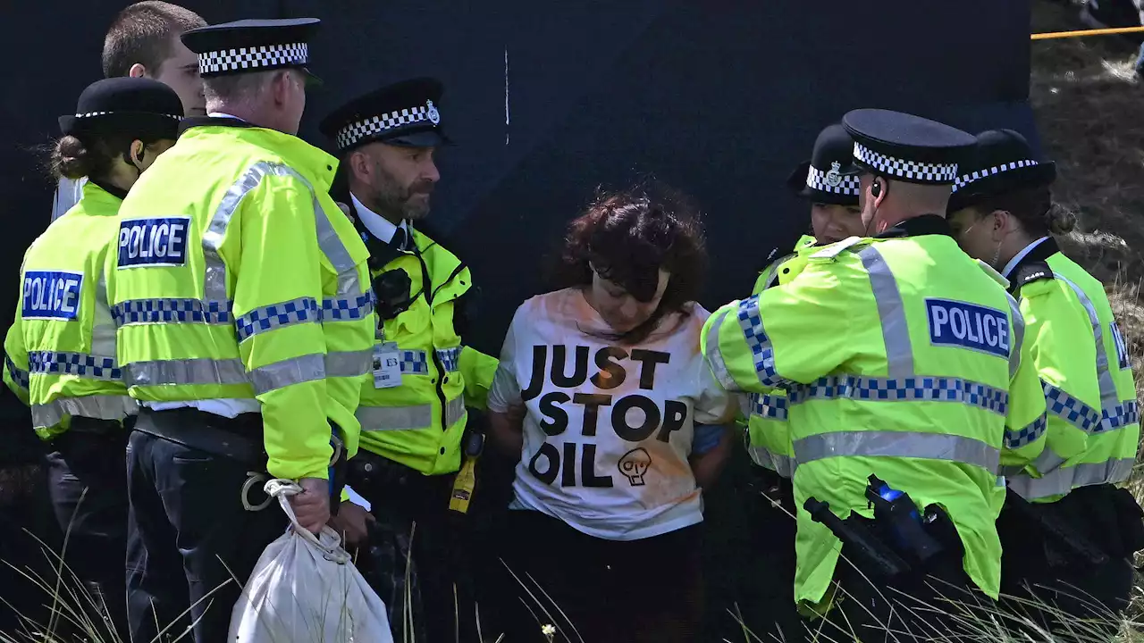 Environmental activists disrupt British Open by throwing orange substance on 17th green